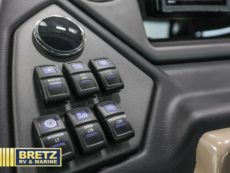 Slide: The Image of Control panel of 2024 L-5 DLZ DH BAR with labeled switches, Bretz RV & Marine logo. - 8