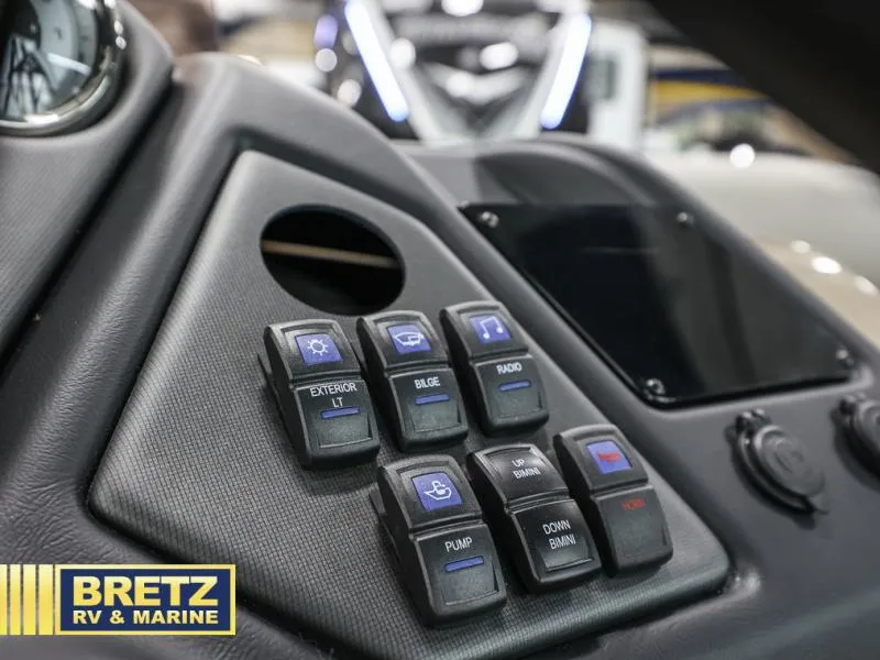 Slide: The Image of Control panel of 2024 L-5 DLZ DH BAR boat with labeled switches at Bretz RV & Marine. - 9
