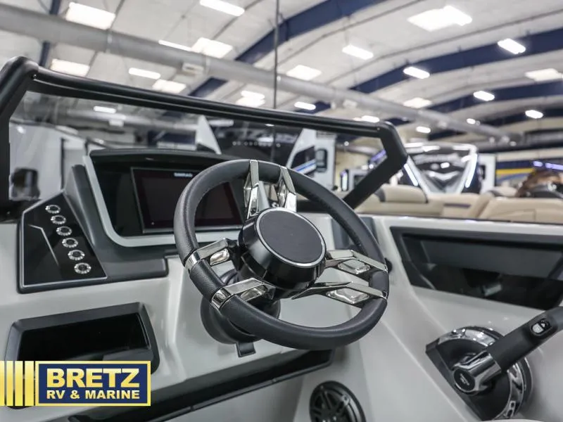 Slide: The Image of 2024 G3 CLZ DC boat steering wheel and dashboard at Bretz RV & Marine showroom. - 11