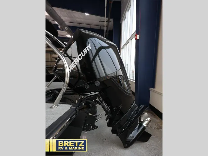 Slide: The Image of 2024 G3 CLZ DC boat with Mercury outboard motor in showroom. - 5
