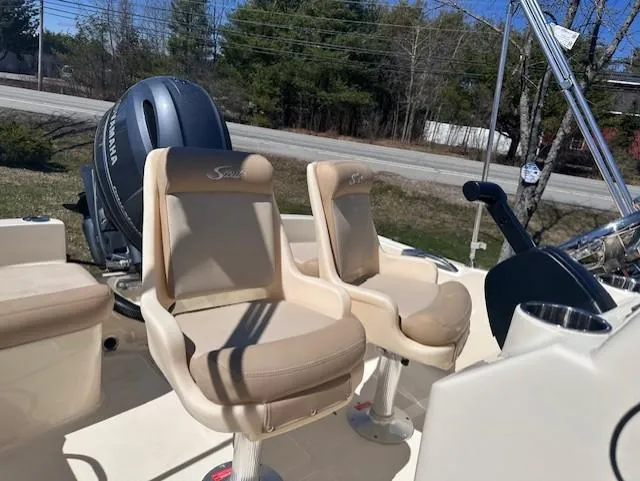 Slide: The Image of 2022 Scout 175 Sportfish boat with Yamaha engine and beige seating. - 3