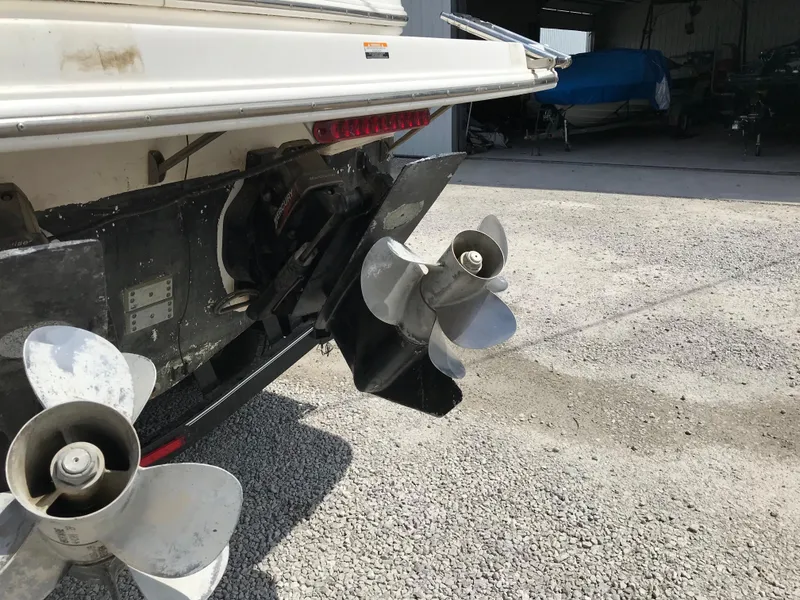 Slide: The Image of 2002 Chaparral Signature 300 boat propellers and stern drive in a storage area. - 15