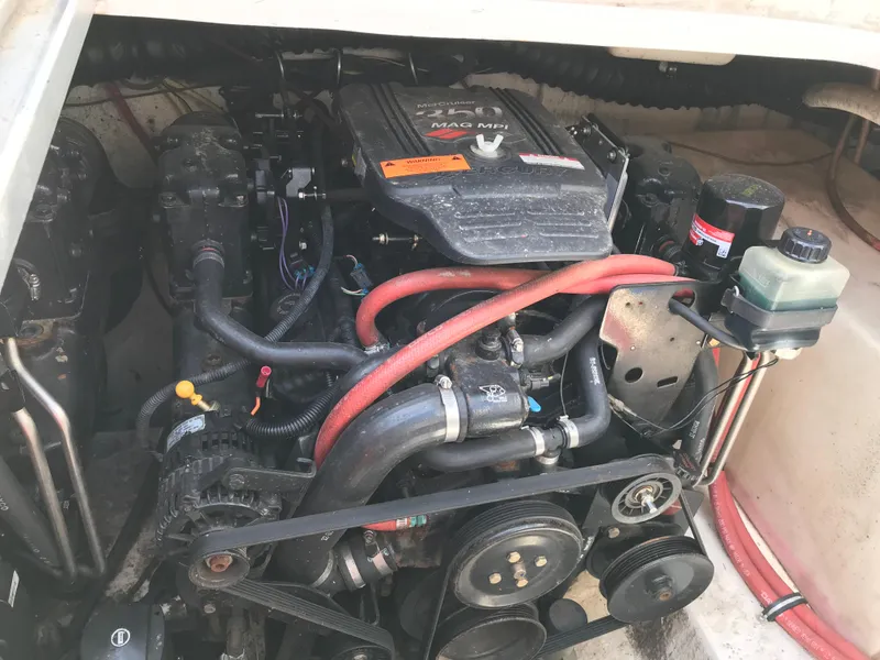 Slide: The Image of 2002 Chaparral Signature 300 engine compartment with visible components and wiring. - 20