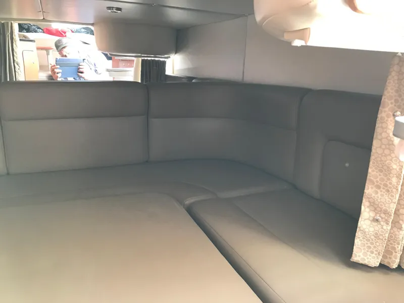 Slide: The Image of Interior cabin of a 2002 Chaparral Signature 300 boat with leather seating. - 26