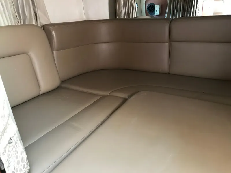 Slide: The Image of 2002 Chaparral Signature 300 interior seating area with beige leather upholstery. - 28