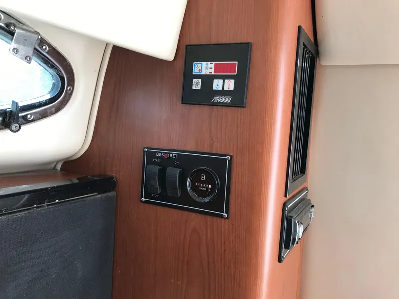 Slide: The Image of Control panel inside a 2002 Chaparral Signature 300 boat cabin. - 30