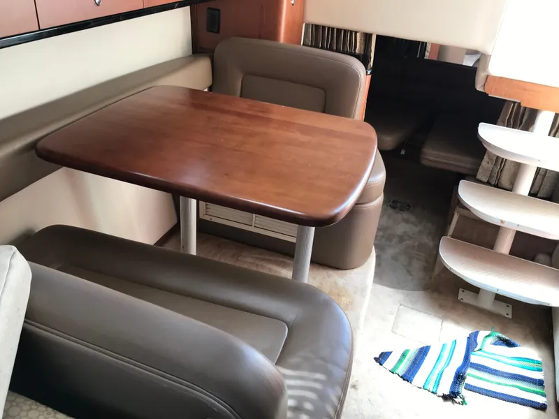 Slide: The Image of Interior of 2002 Chaparral Signature 300 boat with dining table and seating. - 34