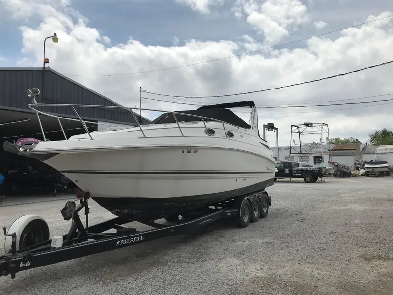 Slide: The Image of 2002 Chaparral Signature 300 boat on a trailer in a marina. - 4