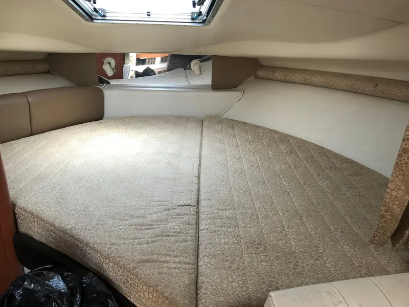 Slide: The Image of Interior cabin of 2002 Chaparral Signature 300 boat with beige upholstery. - 40
