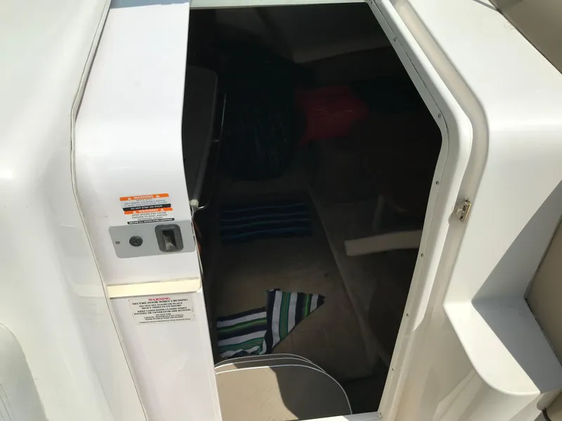 Slide: The Image of 2002 Chaparral Signature 300 cabin entrance with striped towels inside. - 41