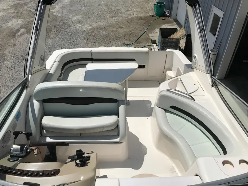 Slide: The Image of 2002 Chaparral Signature 300 boat interior with seating and table. - 42