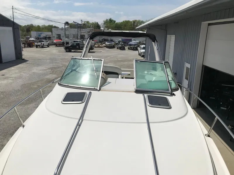 Slide: The Image of 2002 Chaparral Signature 300 boat docked at a marina. - 43