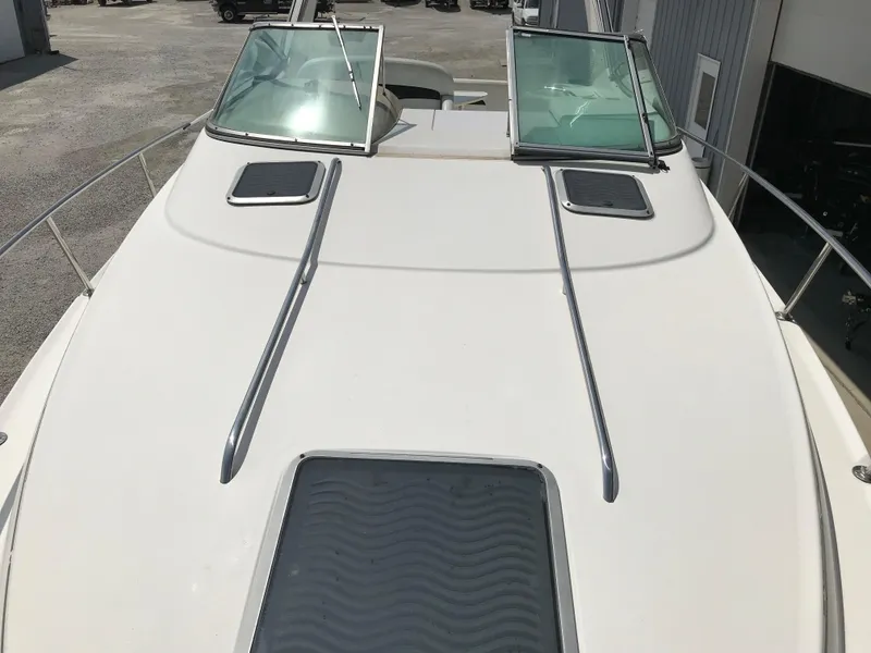 Slide: The Image of 2002 Chaparral Signature 300 boat deck with windshield and hatches. - 44