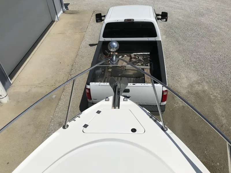 Slide: The Image of Chaparral Signature 300 boat hitched to a white pickup truck, top view, 2002 model. - 45