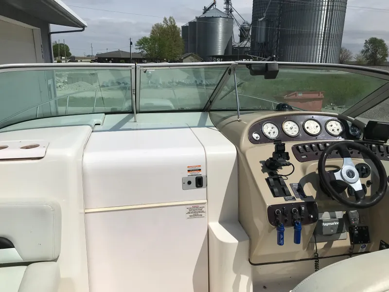Slide: The Image of 2002 Chaparral Signature 300 boat cockpit with steering wheel and control panel. - 48