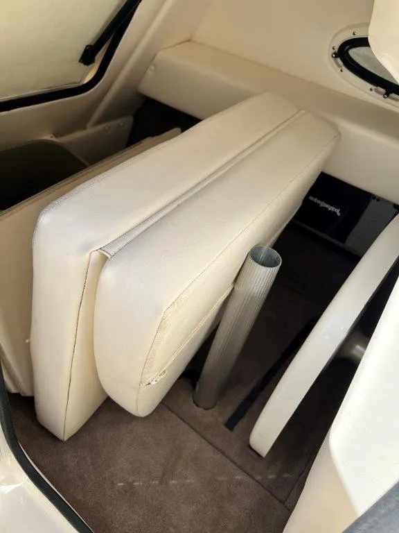 Slide: The Image of 2013 Sea Ray 260 Sundeck interior seating and storage area. - 10