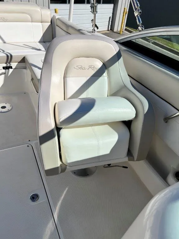 Slide: The Image of 2013 Sea Ray 260 Sundeck boat interior with white captain's chair. - 12