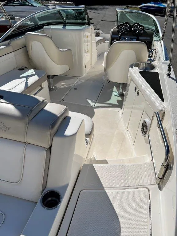 Slide: The Image of 2013 Sea Ray 260 Sundeck interior with white seating and dashboard. - 14