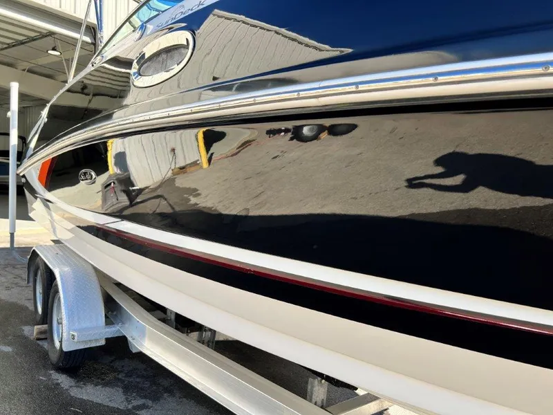 Slide: The Image of 2013 Sea Ray 260 Sundeck boat on trailer, side view. - 15