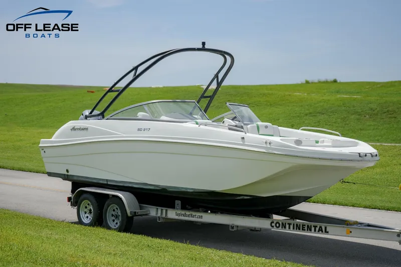 Slide: The Image of 2020 Hurricane 217 SD boat on a Continental trailer, displayed by Off Lease Boats. - 2