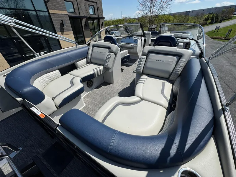 Slide: The Image of 2023 Crest Continental 250 boat with luxurious seating and modern design. - 12