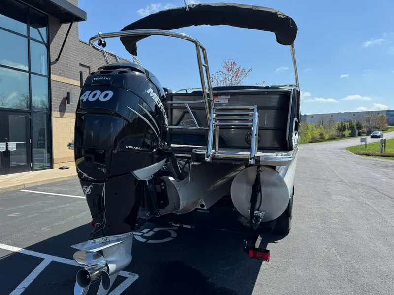 Slide: The Image of 2023 Crest Continental 250 boat with Mercury 400 engine, parked outdoors. - 4