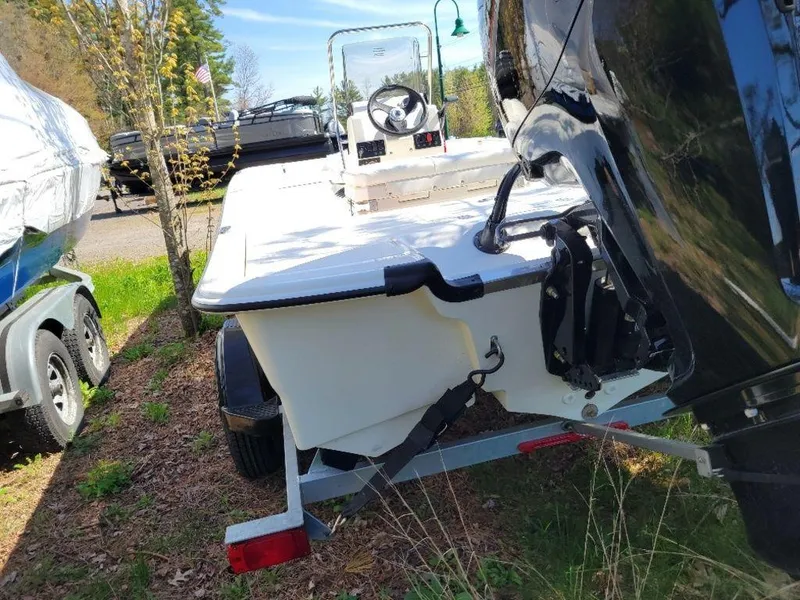 Slide: The Image of 2024 Mako SKIFF 17 CC boat on trailer, rear view with outboard motor. - 11