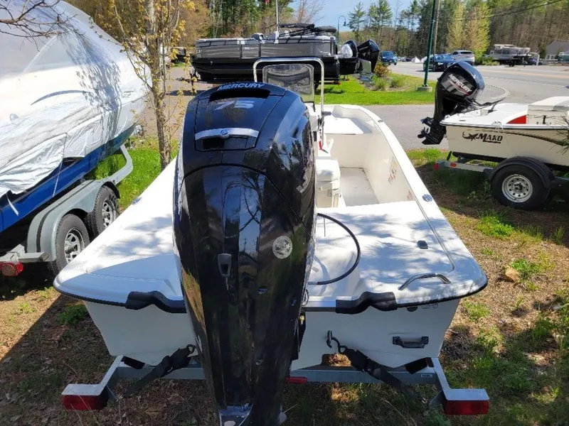 Slide: The Image of 2024 Mako SKIFF 17 CC boat with Mercury outboard motor, parked on a trailer. - 5