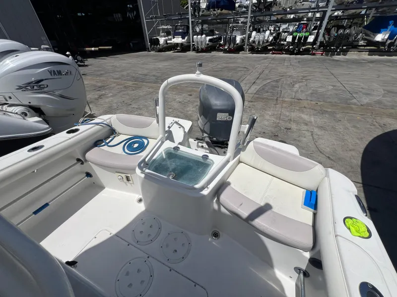 Slide: The Image of 2009 Everglades 210CC boat interior with seating and Yamaha outboard motor. - 2