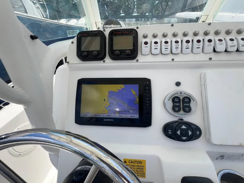 Slide: The Image of 2009 Everglades 210CC boat dashboard with GPS and control panel. - 3