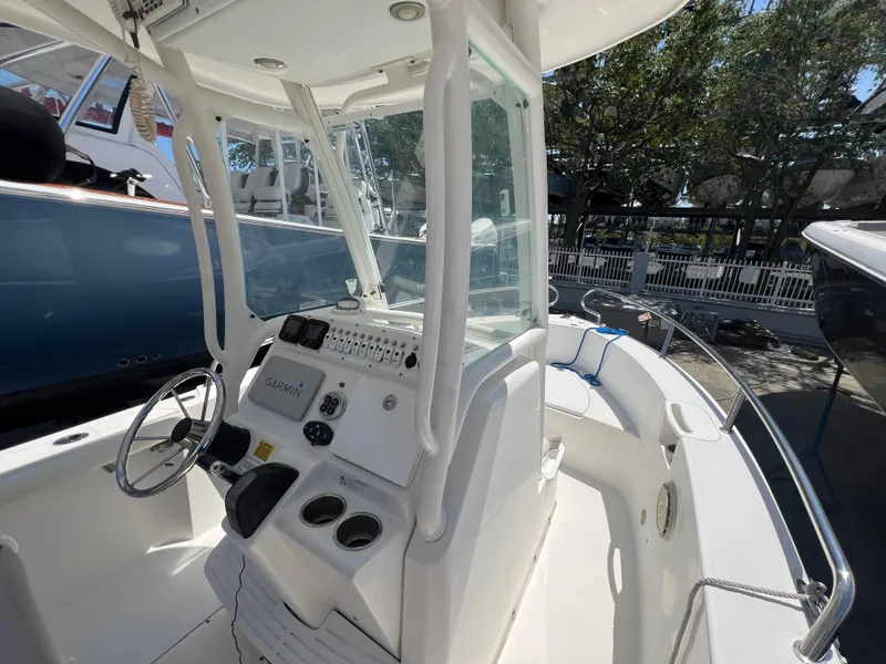 Slide: The Image of 2009 Everglades 210CC center console boat interior with steering wheel and control panel. - 9