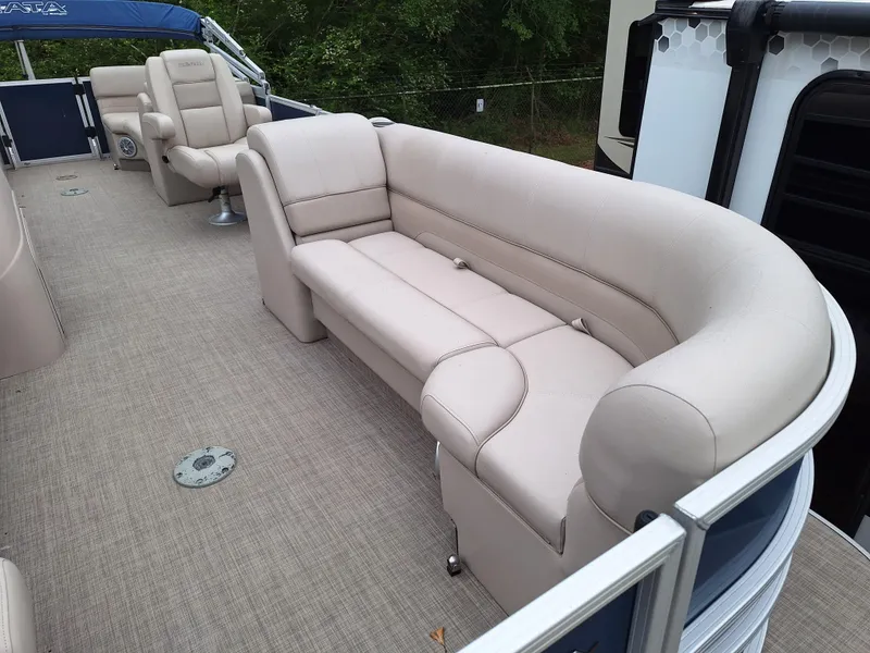 Slide: The Image of 2017 Ranger REATA boat with beige seating and carpeted deck. - 4