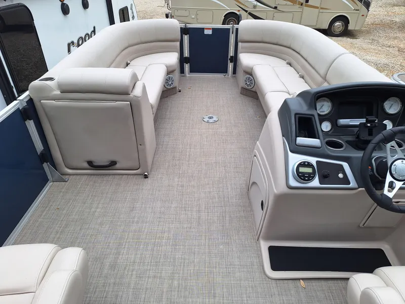 Slide: The Image of 2017 Ranger REATA boat interior with beige seating and modern dashboard. - 6