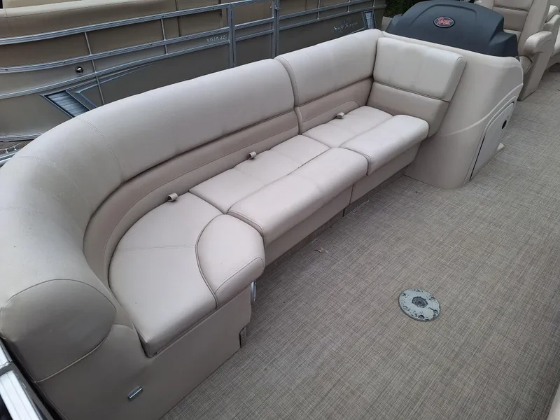 Slide: The Image of 2017 Ranger REATA boat with beige cushioned seating. - 7