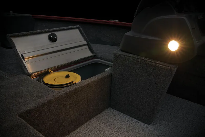 Slide: The Image of 2025 Tracker Super Guide V-16 SC boat storage compartment with interior light. - 13