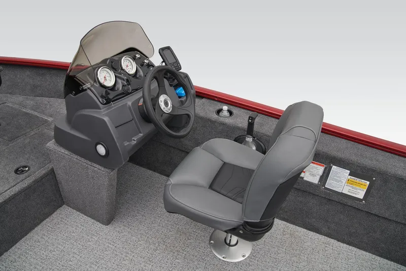 Slide: The Image of 2025 Tracker Super Guide V-16 SC boat cockpit with steering wheel and captain's chair. - 16
