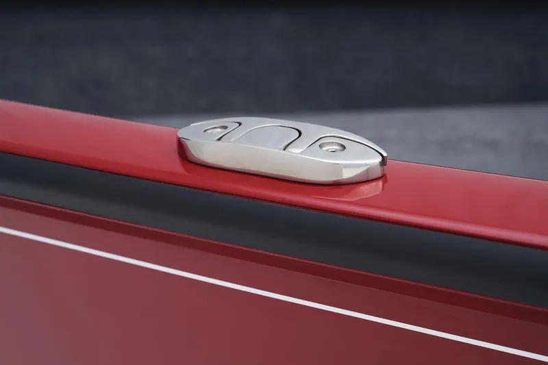 Slide: The Image of Close-up of 2025 Tracker Super Guide V-16 SC boat cleat on red hull. - 22