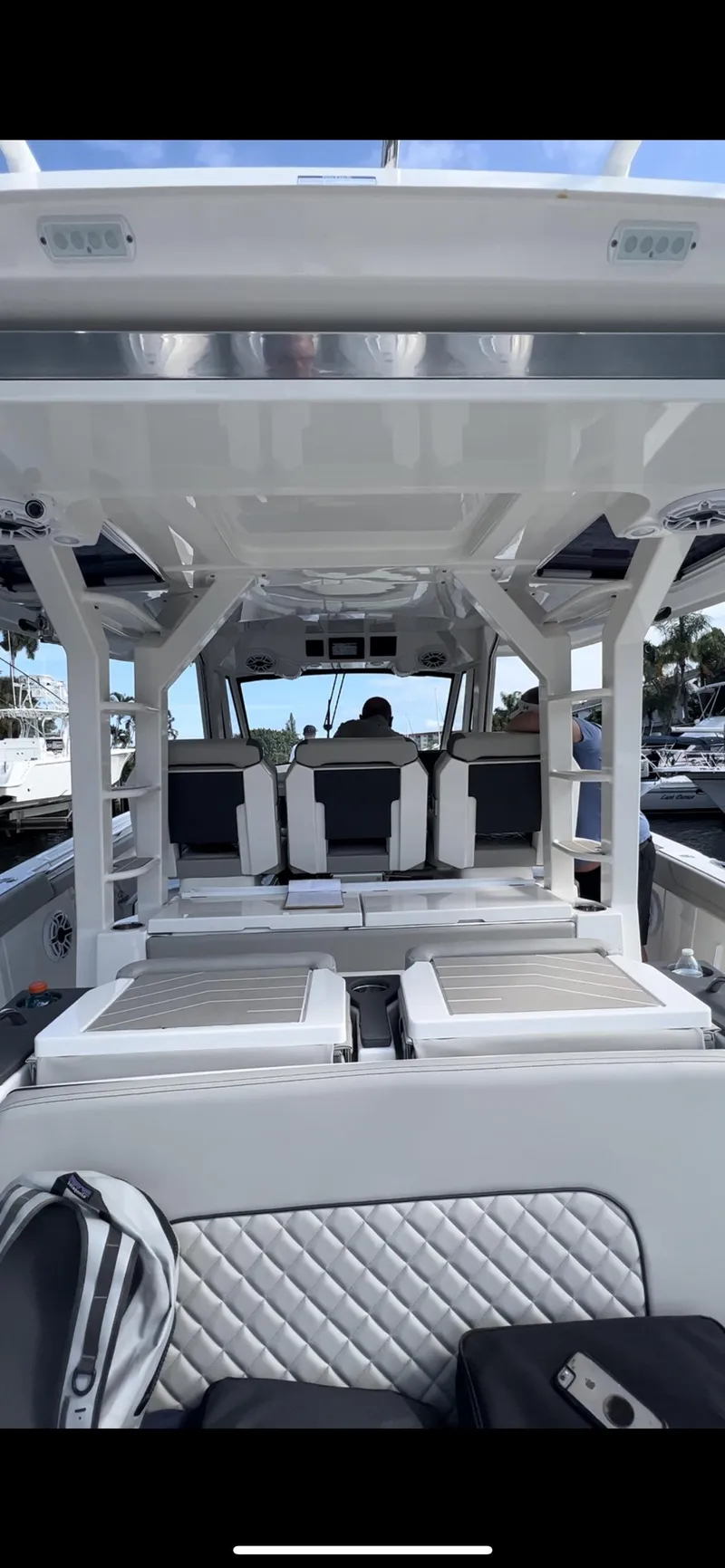 Slide: The Image of 2022 Pursuit S 428 Sport boat interior with seating and helm. - 17