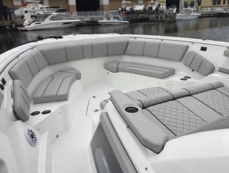 Slide: The Image of 2022 Pursuit S 428 Sport boat with spacious seating area and luxurious upholstery. - 19