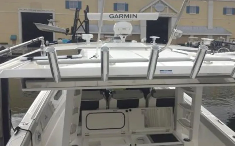 Slide: The Image of 2022 Pursuit S 428 Sport boat with Garmin equipment docked at marina. - 21