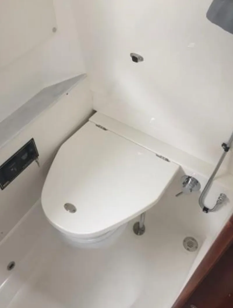 Slide: The Image of 2022 Pursuit S 428 Sport boat bathroom with modern toilet. - 23