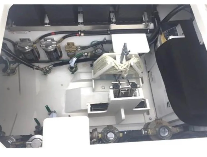 Slide: The Image of 2022 Pursuit S 428 Sport boat engine compartment with various mechanical components. - 25