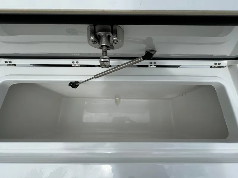 Slide: The Image of Open storage compartment of 2022 Sea Hunt 27 Gamefish boat. - 19