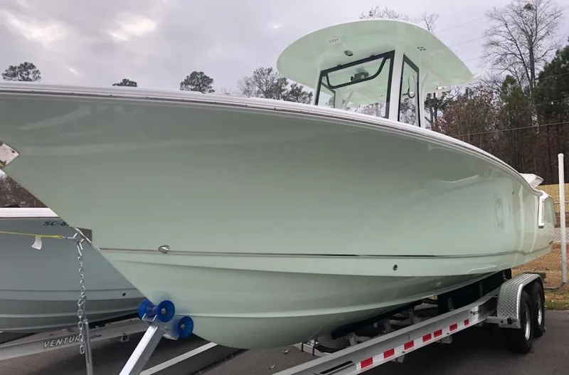 Slide: The Image of 2022 Sea Hunt 27 Gamefish boat on a trailer, side view. - 3