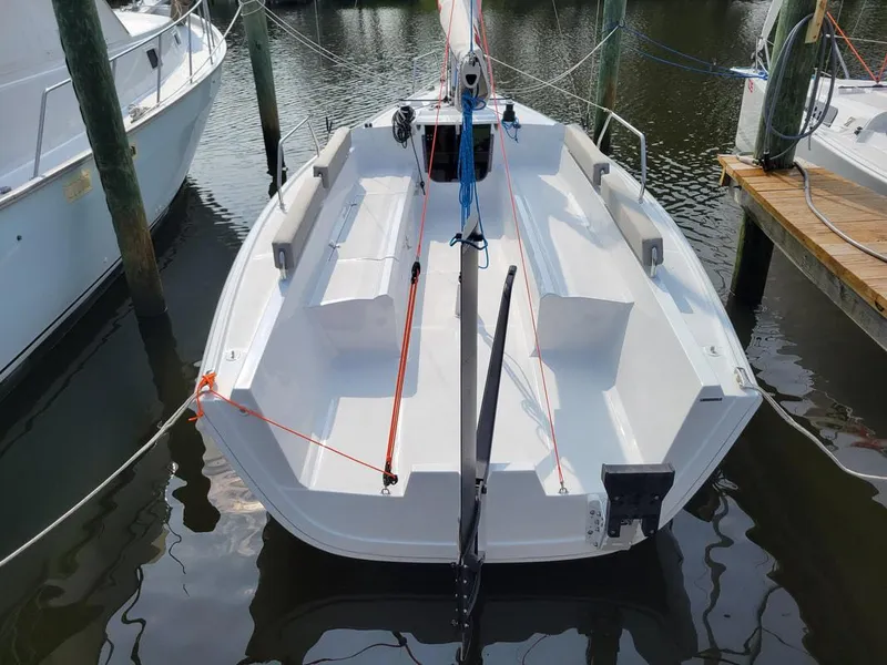 Slide: The Image of 2024 Zonda Z24 sailboat docked, showcasing sleek design and spacious cockpit. - 3