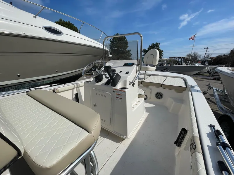 Slide: The Image of 2024 Carolina Skiff 19 LS boat interior with steering console and seating. - 1