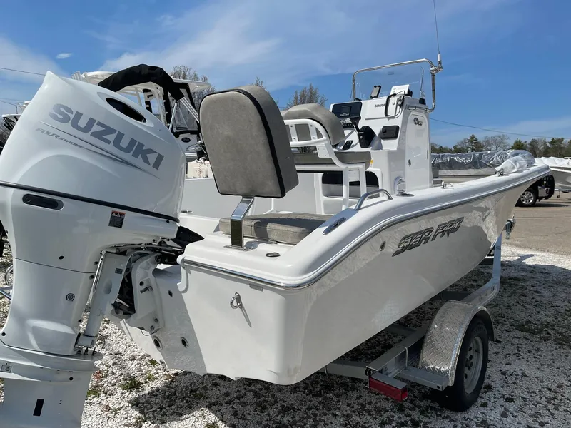 Slide: The Image of 2024 Sea Pro 202 Center Console boat with Suzuki outboard motor on trailer. - 1