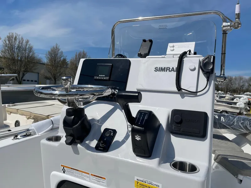 Slide: The Image of 2024 Sea Pro 202 Center Console boat dashboard with Simrad electronics. - 2