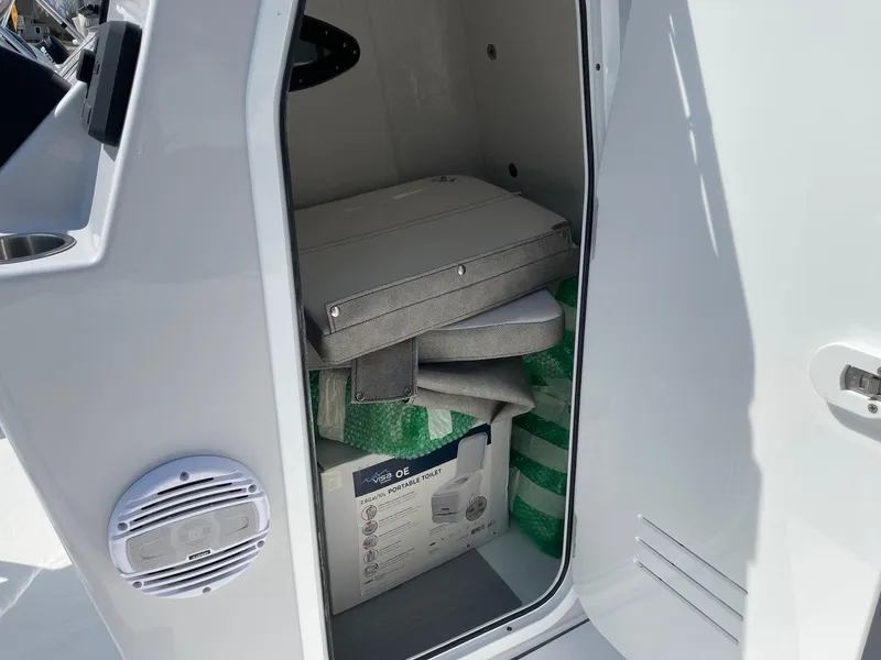 Slide: The Image of Storage compartment of 2024 Sea Pro 202 Center Console boat with cushions and equipment. - 3