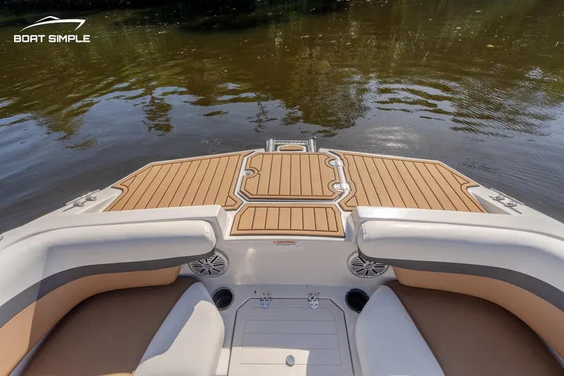 Slide: The Image of 2022 Starcraft SVX 191 OB boat interior with tan seating and wood deck. - 8